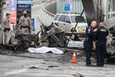 California Highway Patrol and other officials investigate the crash site on Aug. 4, 2022, in Los Angeles.